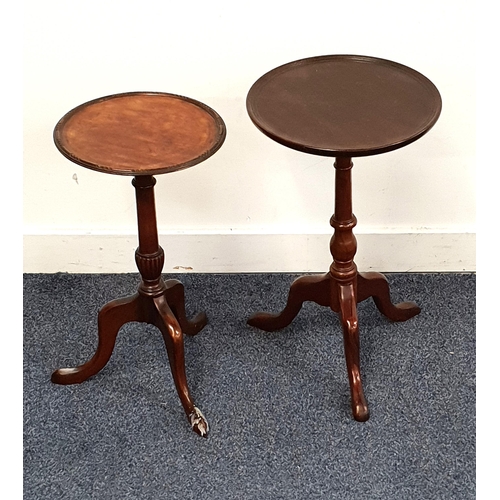 TWO MAHOGANY WINE TABLES
each with a circular top on a turned column and tripod base, 51cm and 50cm high (2)