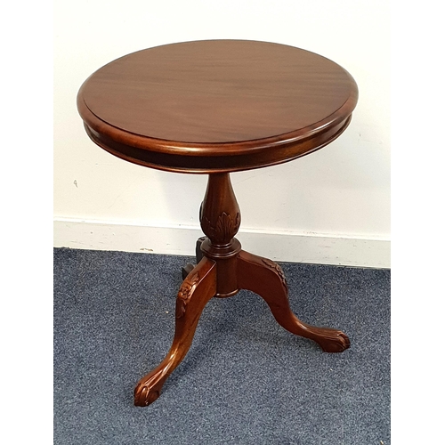 448 - TEAK OCCASIONAL TABLE
the circular top on a turned column and tripod base, 67cm high