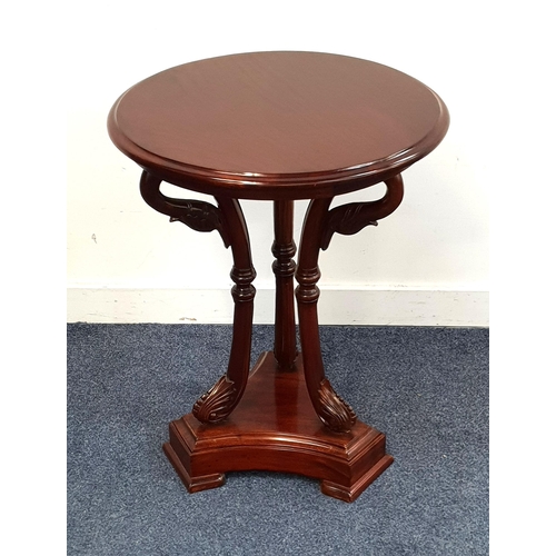 450 - MAHOGANY OCCASIONAL TABLE
with a circular moulded top on three ornate carved swan neck supports and ... 