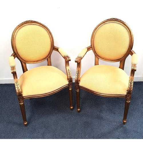 453 - PAIR OF LOUIS XVI STYLE ARM CHAIRS
with gilt wood carved frames, oval padded backs and shaped padded... 