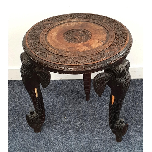 463 - 19th CENTURY ANGLO INDIAN CARVED TEAK OCCASIONAL TABLE
the circular top decorated with a floral bord... 