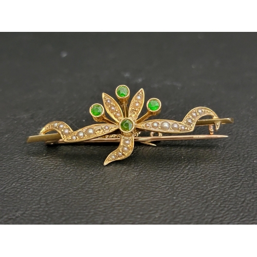 16 - EDWARDIAN GREEN GARNET AND SEED PEARL BROOCH
in fifteen carat gold and with safety chain, 4.5cm wide... 