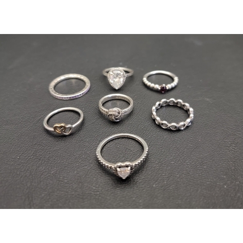 31 - SEVEN PANDORA SILVER RINGS
comprising Shimmering Knot, Simple Infinity Band, Purple Radiant Hearts o... 