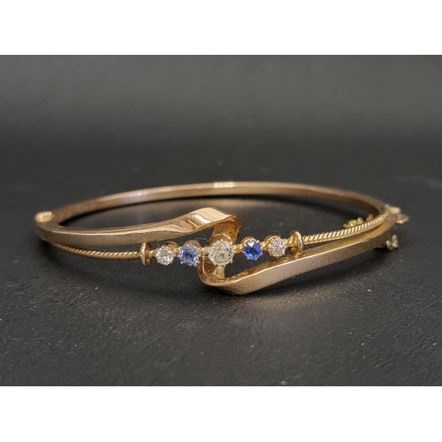 97 - EARLY 20th CENTURY DIAMOND AND SAPPHIRE SET BANGLE
the five graduated gemstones in attractive twist ... 