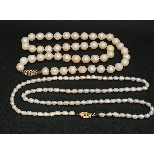 TWO PEARL NECKLACES
one with smaller pearls and fourteen carat gold clasp, 53cm long; the other with larger pearls and CZ set clasp, 45cm long (2)