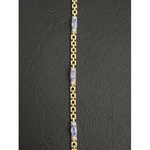 109 - TANZANITE AND DIAMOND BRACELET
each of the five oval cut tanzanites with small diamonds to each side... 