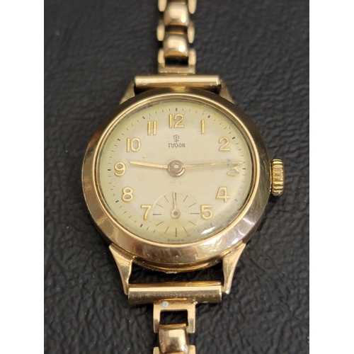 119 - LADIES TUDOR NINE CARAT GOLD WRISTWATCH
circa 1960s, the round dial with Arabic numerals and subsidi... 