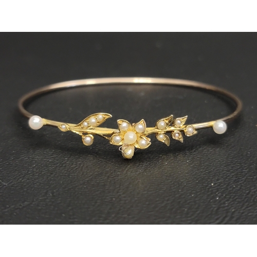 126 - PRETTY SEED PEARL SET BANGLE
in unmarked gold, approximately 5.1 grams