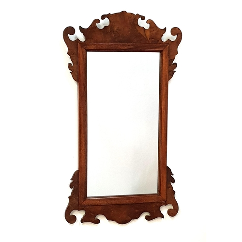 443 - GEORGE II STYLE FRET CARVED WALNUT MIRROR
with a plain rectangular plate, 76.5cm x 43cm