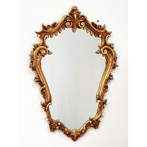 449 - BAROQUE STYLE GILT FRAME WALL MIRROR
with a shaped plate, 73cm x 49.5cm