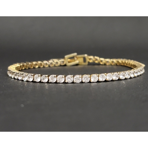 114 - CZ LINE BRACELET
in fourteen carat gold, approximately 19cm long and 12 grams