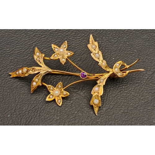 82 - SEED PEARL AND AMETHYST SPRAY BROOCH
in nine carat gold, 5cm wide and approximately 3 grams