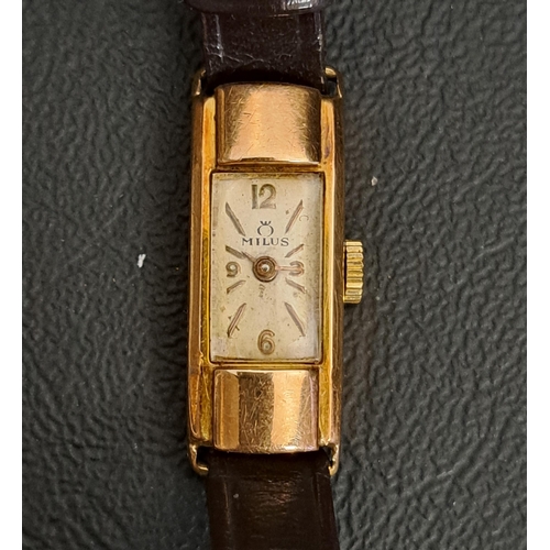 96 - LADIES MILUS EIGHTEEN CARAT GOLD CASED WRISTEATCH
the rectangular dial with Arabic numerals at 3, 6,... 