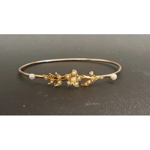 126 - PRETTY SEED PEARL SET BANGLE
in unmarked gold, approximately 5.1 grams