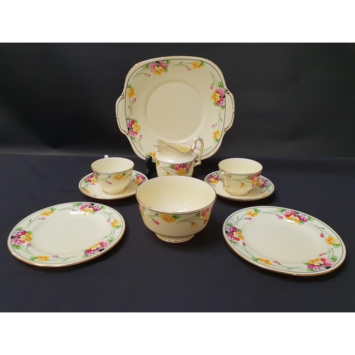 212 - CROWN STAFFORDSHIRE TEA SET
decorated with a yellow ground with a floral border and gilt highlights,... 