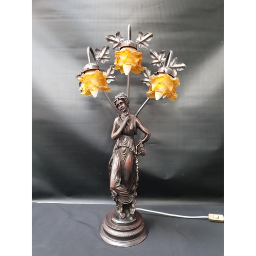 227 - LARGE RESIN CLASSICAL LAMP
depicting a lady in flowing robes with three amber coloured lamps, 84cm h... 