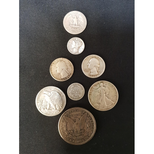 SELECTION OF UNITED STATES .900 SILVER COINS
comprising a 1921 Morgan dollar, two half dollars - 1939 and 1943, three quarter dollars - 1934, 1936, and 1934; and two dimes - 1906 and 1935, total weight approximately 74.5 grams