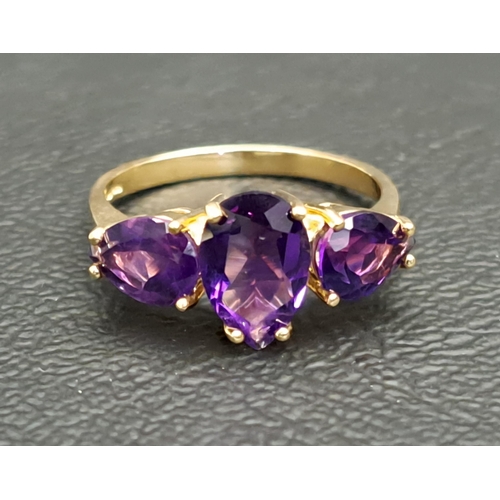 112 - AMETHYST THREE STONE RING
the central pear cut amethyst approximately 1ct flanked by a round cut ame... 