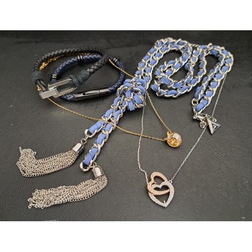 SELECTION OF FASHION JEWELLERY
including two Swarovski crystal necklaces on chains, one with double heart pendant, a Guess statement necklace, a Tommy Hilfiger plaited leather bracelet and a Hejar plaited bracelet