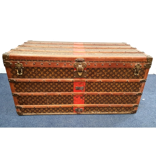 269 - VINTAGE LOUIS VUITTON LARGE MONOGRAM STEAMER TRUNK
with wood banding and metal fixtures, the brass l... 