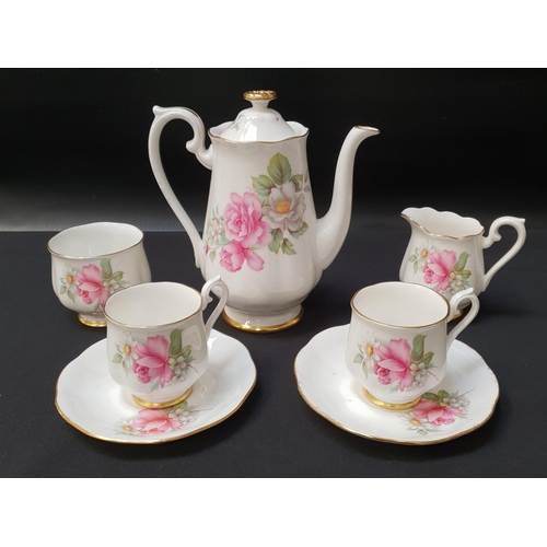 220 - BONE CHINA COFFEE SET
decorated with a white ground and roses with gilt highlights, signed to the un... 