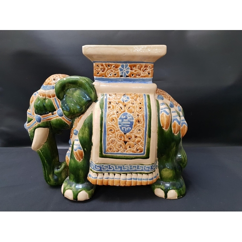 224 - LARGE GREEN MAJOLICA STYLE INDIAN ELEPHANT PEDESTAL
with a square pedestal to its back above pierced... 