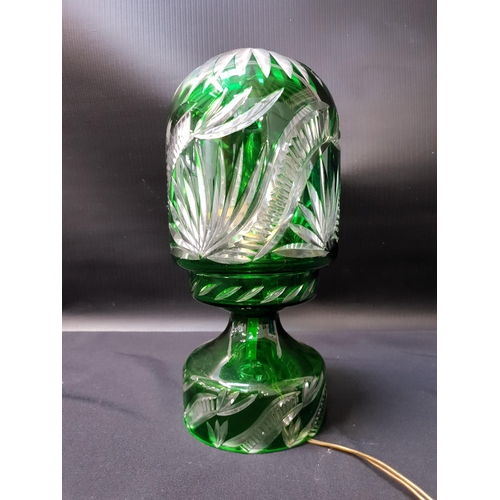 226 - EDWARDIAN EMERALD GLASS TABLE LAMP
raised on a circular base with a domed top, 30.5cm high