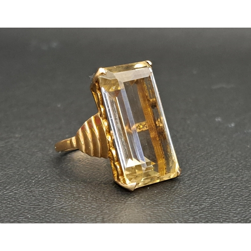 14 - LARGE CITRINE SINGLE STONE DRESS RING
the step cut citrine measuring approximately 24mm x 13mm x 8mm... 