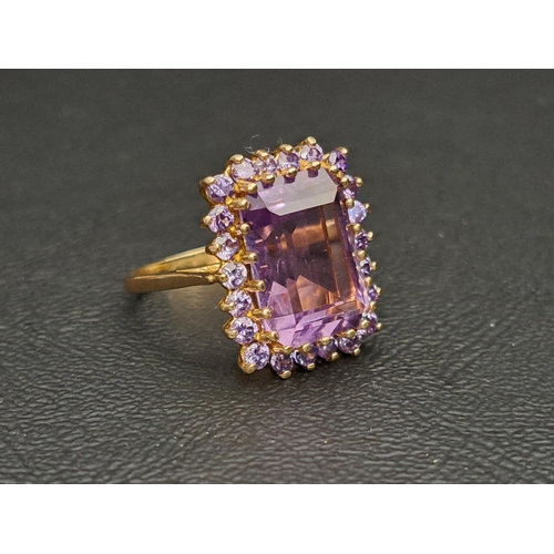 36 - AMETHYST CLUSTER DRESS RING
the central step cut amethyst measuring approximately 14mm x 10mm x 6.5m... 