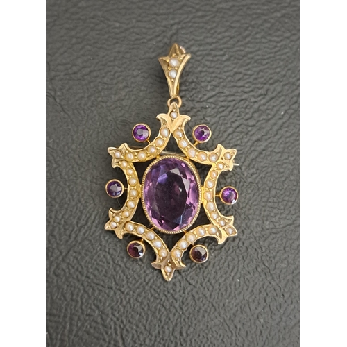 EARLY 20th CENTURY AMETHYST AND SEED PEAR PENDANT
the central oval cut amethyst approximately 3cta in seed pearl and further amethyst set surround, in nine carat gold, 4.1cm high (including suspension loop) and approximately 3.9 grams
