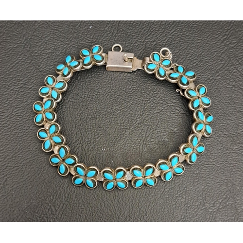 NATIVE AMERICAN TURQUOISE SET SILVER BRACELET
with quatrefoil links, marked 'Louis & Janice CHAVEZ III'