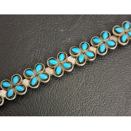 71 - NATIVE AMERICAN TURQUOISE SET SILVER BRACELET
with quatrefoil links, marked 'Louis & Janice CHAVEZ I... 