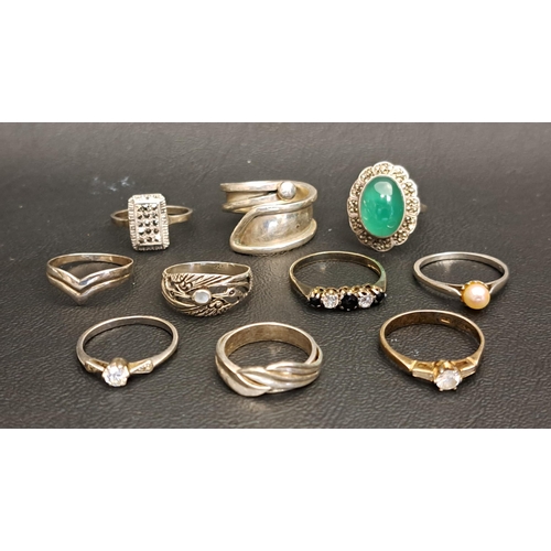 102 - SELECTION OF ELEVEN SILVER RINGS
including a sapphire and CZ five stone ring, a Mexican silver twist... 