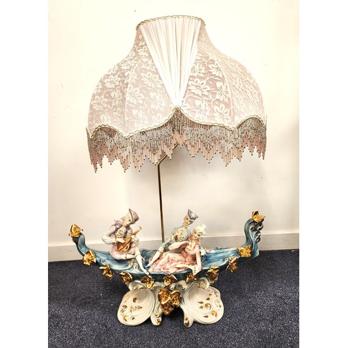 229 - LARGE ITALIAN POTTERY TABLE LAMP
depicting a courting couple and a musician in a gondola, on an orna... 