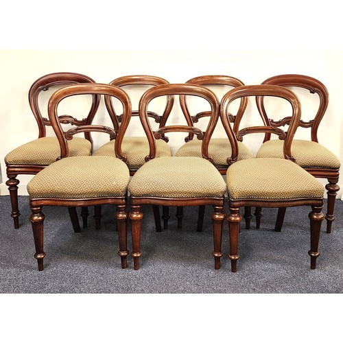 391 - SEVEN ASSOCIATED VICTORIAN MAHOGANY BALLOON BACK DINING CHAIRS
with shaped stuffover seats standing ... 