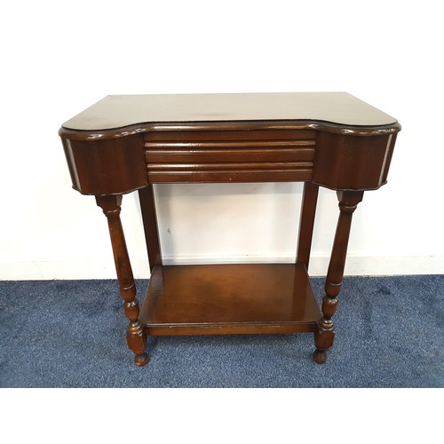 404 - 1950s OAK SIDE TABLE
with an inverted front and frieze drawer, standing on turned supports united by... 