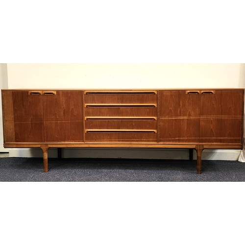 432 - MCINTOSH TEAK SIDEBOARD
with four central drawers flanked by two pairs of cupboard doors, standing o... 