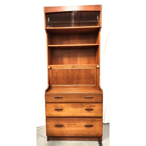 434 - DANISH TEAK SECRETAIRE
with a pair of sliding glass doors with interior light above two shelves with... 