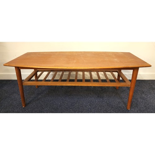 438 - RETRO TEAK OCCASIONAL TABLE
with a shaped top above a slatted undertier, standing on turned supports... 