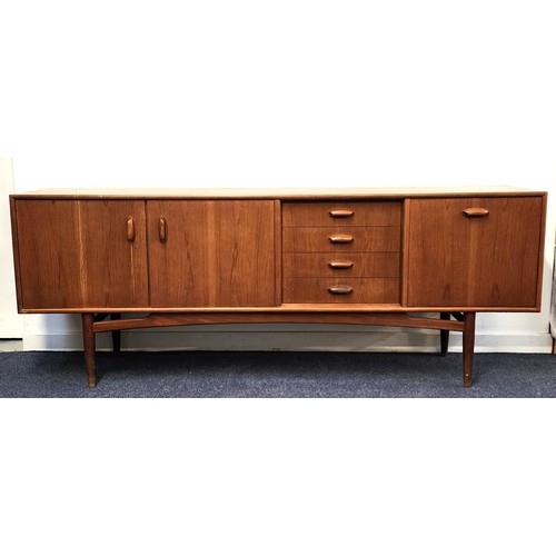 439 - G PLAN TEAK SIDEBOARD
with four drawers, a pull down door and a pair of cupboard doors, standing on ... 