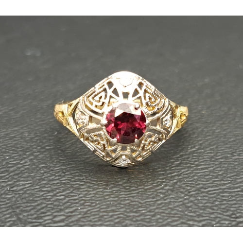 GARNET AND DIAMOND DRESS RING
the round cut garnet approximately 0.8cts in rounded and pierced diamond set surround, on a nine carat gold shank, ring size P-Q