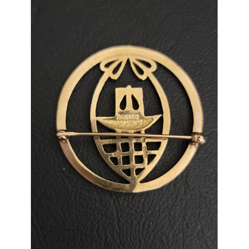 66 - ART NOUVEAU STYLE NINE CARAT GOLD CIRCULAR BROOCH
with pierced motif decoration, 3.3cm diameter and ... 