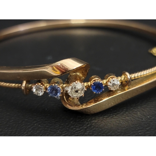 97 - EARLY 20th CENTURY DIAMOND AND SAPPHIRE SET BANGLE
the five graduated gemstones in attractive twist ... 