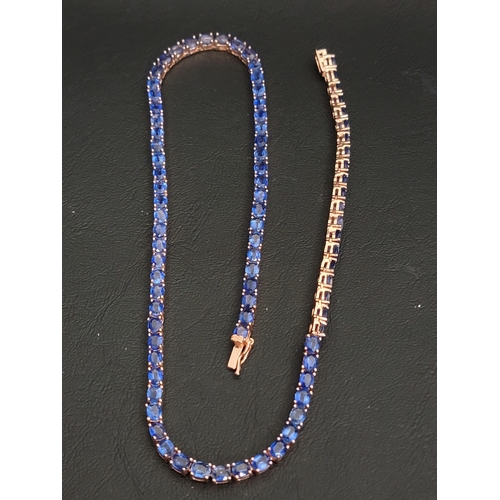 SAPPHIRE LINE NECKLACE
in rose gilt on silver, set with eighty-four oval cut sapphires of approximately 0.3cts each (25.2cts in total), 45cm long