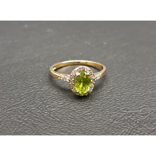 PERIDOT AND DIAMOND CLUSTER RING
the central oval cut peridot approximately 0.75cts in diamond surround and with further diamonds to the shoulders, on nine carat gold shank, ring size M-N