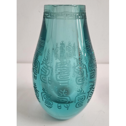 CHINESE BLUE GLASS VASE 
of bulbous form with engraved decoration to the neck and body, 21.5cm high