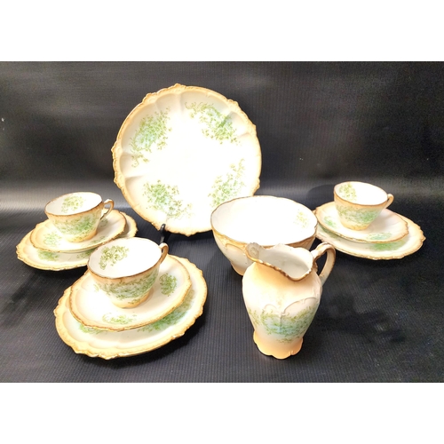 EARLY 20th CENTURY TEA SET
with a white ground decorated with floral sprays and gilt highlights, comprising eight cups, nine saucers, ten side plates, two cake/sandwich plates, tea bowl and milk jug