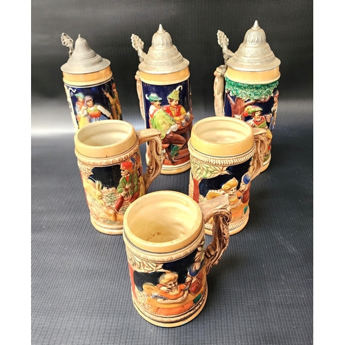 SIX GERMAN POTTERY BEER STEINS
all with relief decoration, three with domed pewter lids (6)