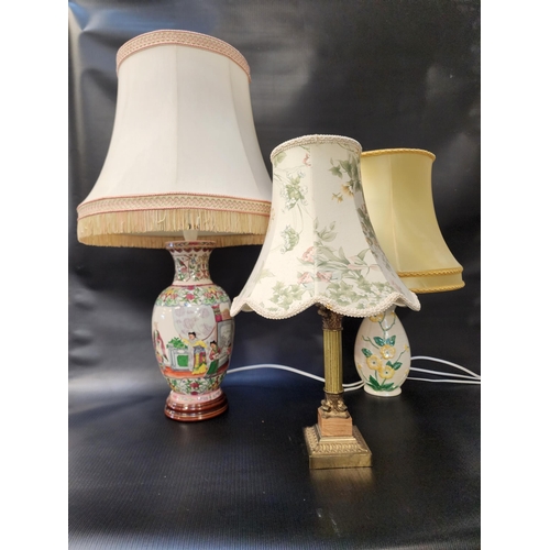 258 - JAPANESE STYLE TABLE LAMP
decorated with classical figures, with a shaped cream shade, 75cm high ove... 