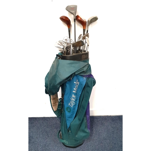 SET OF GOLF CLUBS
comprising 1, 1.5 and two 3 drivers, 1, 3, 4, 5, 6, 7, 9 and 10 irons and two putters, in a green nylon Taylor Made bag